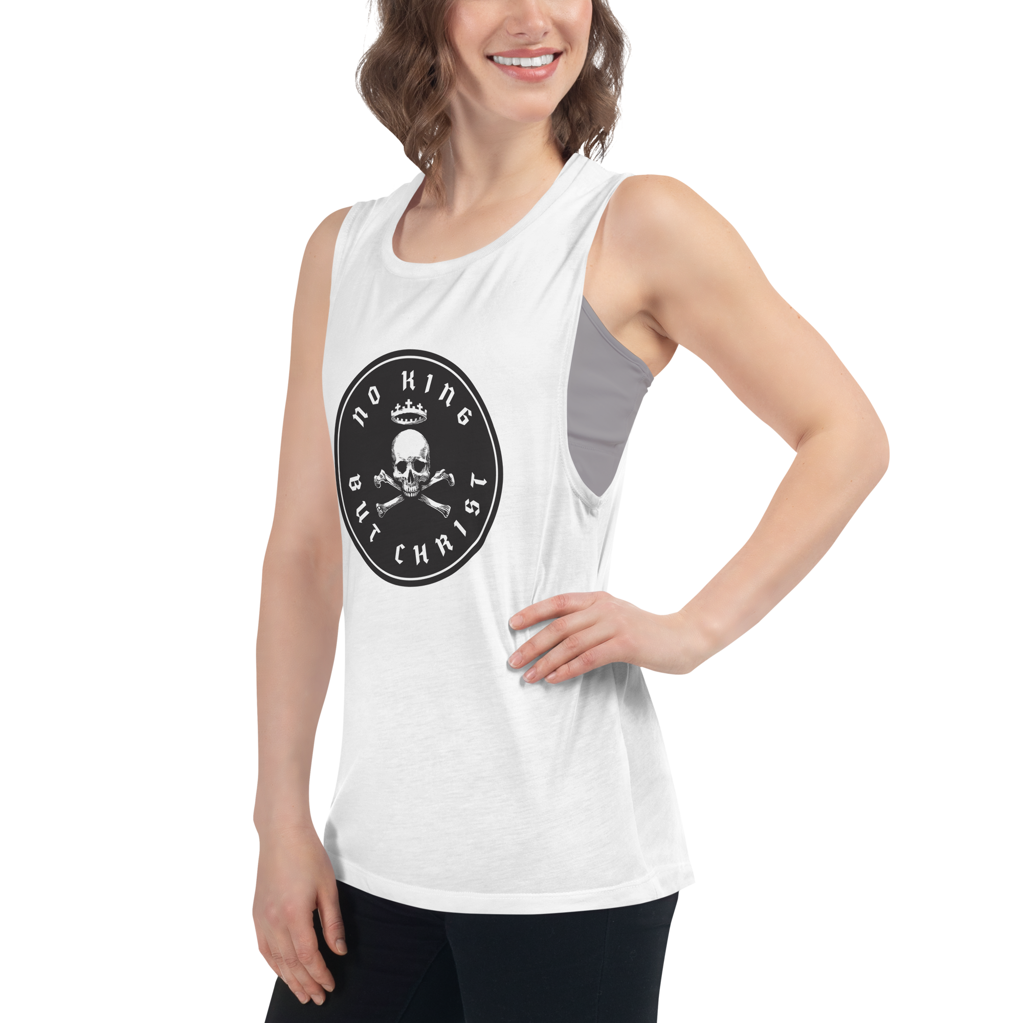 Woman wearing white No King But Christ seal women's flowy muscle tank in angled front left view featuring black crowned skull-and-crossbones emblem, faith-based apparel by Glenn Beck Shop
