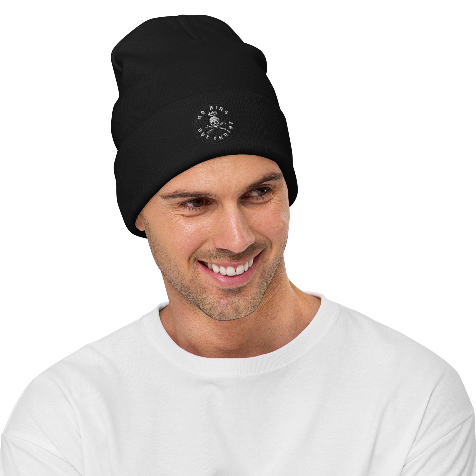 Man wearing black embroidered beanie with No King But Christ seal, unisex knit hat, clean stitching and uncluttered design.